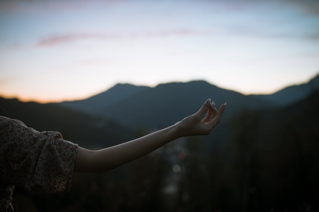 A serene moment of meditation outdoors, capturing tranquility and peace at dusk.